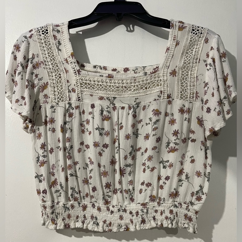 White floral shirt.